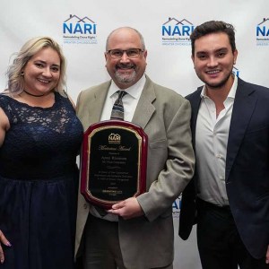 Aron-Rissman-with-Presidents-Award-Trophy-Meritorious-Award