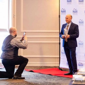 GMD-taking-photo-of-Omar-with-trophy