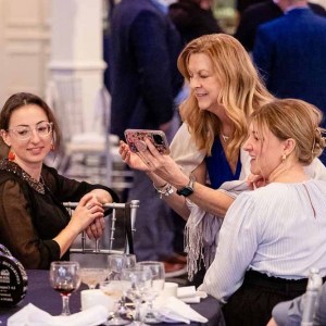 Liv-team-taking-photos-of-trophies-on-table