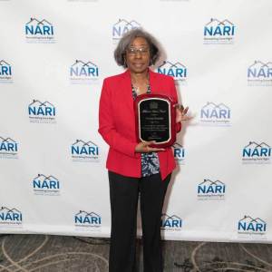 Sonia-posing-with-Distinctive-Service-award