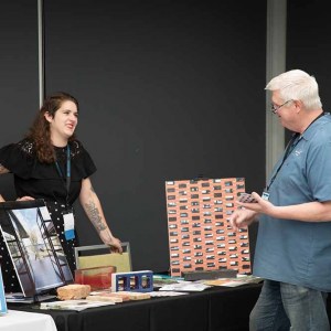 Bricks-Inc-Expo-table-with-guest